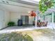 Covered patio features an outdoor grill, plants, and a picnic table for backyard relaxation at 3446 Broadwick St, Charlotte, NC 28213