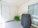 Covered patio features a new grill, concrete floors, and a view of the backyard at 3446 Broadwick St, Charlotte, NC 28213