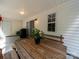 Covered patio with a picnic table, grill, and access to the backyard at 3446 Broadwick St, Charlotte, NC 28213