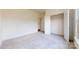 A carpeted bedroom features a closet and a large window, providing ample natural light at 3719 Wave Rock Ct, Fort Mill, SC 29707