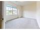Carpeted bedroom with large window looking out to residential homes at 3719 Wave Rock Ct, Fort Mill, SC 29707