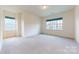 Expansive bedroom with large windows providing ample natural light and neighborhood views at 3719 Wave Rock Ct, Fort Mill, SC 29707