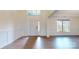 Bright foyer with wainscoting, hardwood floors, a white front door, and a transom window at 3719 Wave Rock Ct, Fort Mill, SC 29707