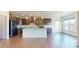 Modern kitchen featuring dark cabinets, a center island with seating, and stainless steel appliances at 3719 Wave Rock Ct, Fort Mill, SC 29707