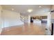 Spacious living room with hardwood floors that seamlessly connects to the kitchen and a staircase at 3719 Wave Rock Ct, Fort Mill, SC 29707