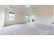 An expansive carpeted main bedroom, with abundant natural light and a view into the main bath at 3719 Wave Rock Ct, Fort Mill, SC 29707