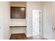 A cozy built-in office nook with a cabinet and counter next to a doorway at 3719 Wave Rock Ct, Fort Mill, SC 29707