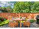 This backyard features both patio and grassy areas, great for outdoor dining at 3810 Selwyn Farms Ln # 3, Charlotte, NC 28209