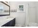 This bathroom features a shower/tub combo and updated vanity at 3810 Selwyn Farms Ln # 3, Charlotte, NC 28209