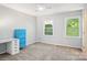 This bedroom has a ceiling fan, two windows, and a desk at 3810 Selwyn Farms Ln # 3, Charlotte, NC 28209