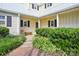 Charming home entrance with lush landscaping and a classic bench, inviting guests at 3810 Selwyn Farms Ln # 3, Charlotte, NC 28209