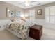 Cozy bedroom featuring a floral patterned bedspread, shuttered windows, and neutral-toned walls, creating a serene space at 3909 Black Sycamore Dr, Charlotte, NC 28226