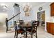 Charming dining area with a round table and views of the staircase and wallpapered hallway at 3909 Black Sycamore Dr, Charlotte, NC 28226