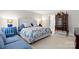 Serene bedroom with blue and white bedding, elegant furniture, and soft lighting, creating a peaceful retreat at 3909 Black Sycamore Dr, Charlotte, NC 28226