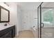 Bright bathroom with a vanity, separate shower and tub, and tiled floors at 392 Winecoff Woods Nw Dr, Concord, NC 28027