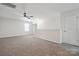 Open bonus room with neutral carpet, bright windows and doorway to hall at 392 Winecoff Woods Nw Dr, Concord, NC 28027