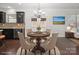 Cozy breakfast nook features a chandelier and opens to a well-appointed kitchen at 392 Winecoff Woods Nw Dr, Concord, NC 28027
