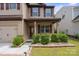 Charming two-story home with a well-maintained front yard and inviting porch, offering curb appeal and character at 392 Winecoff Woods Nw Dr, Concord, NC 28027