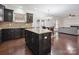 Spacious kitchen boasts dark cabinets, granite countertops, and an open layout at 392 Winecoff Woods Nw Dr, Concord, NC 28027