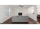 Comfortable living room featuring hardwood floors, fireplace, and plenty of natural light at 392 Winecoff Woods Nw Dr, Concord, NC 28027