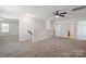 Spacious loft area with neutral walls and carpet, ideal for flexible living at 392 Winecoff Woods Nw Dr, Concord, NC 28027