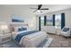 Staged main bedroom with a king bed, bright windows, and calming blue accents at 392 Winecoff Woods Nw Dr, Concord, NC 28027