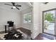 Inviting entryway with hardwood floors, natural light, and view into a charming home office space at 392 Winecoff Woods Nw Dr, Concord, NC 28027
