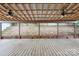Spacious covered patio featuring a wooden floor, metal ceiling and a panoramic view of the backyard at 392 Winecoff Woods Nw Dr, Concord, NC 28027