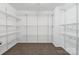 Walk-in closet boasts ample shelving and storage space at 392 Winecoff Woods Nw Dr, Concord, NC 28027