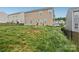 Backyard featuring a two story home, grass and a fence at 3985 Village Nw Blvd, Conover, NC 28613