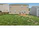Backyard featuring a two story home, grass and a patio at 3985 Village Nw Blvd, Conover, NC 28613