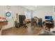 View of home entryway with door, wood flooring, and cluttered furniture at 3985 Village Nw Blvd, Conover, NC 28613