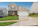 Charming two-story home with a well-manicured lawn and inviting front porch area at 3985 Village Nw Blvd, Conover, NC 28613
