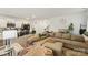 Open-concept living room with comfortable seating adjacent to kitchen area at 3985 Village Nw Blvd, Conover, NC 28613
