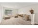 Spacious living room featuring neutral carpet and a large window for natural light at 3985 Village Nw Blvd, Conover, NC 28613