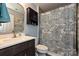 Bathroom featuring a vanity with dark wood cabinets, a large mirror, and a patterned shower curtain at 4018 Harmattan Dr, Denver, NC 28037