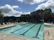 Community pool with lounge chairs offers a refreshing and relaxing space for residents to unwind and enjoy the outdoors at 4018 Harmattan Dr, Denver, NC 28037