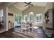 Bright dining room with vaulted ceilings, modern table and chairs, and abundant natural light at 4018 Harmattan Dr, Denver, NC 28037