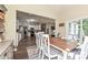 Open-concept dining space with stylish chairs and a view into the adjacent kitchen and living area at 4018 Harmattan Dr, Denver, NC 28037