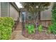 Inviting front entrance with manicured landscaping, a brick facade, and a charming doorway creating a welcoming curb appeal at 4018 Harmattan Dr, Denver, NC 28037