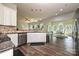 Open-concept kitchen with granite countertops, stainless steel appliances, and hardwood floors at 4018 Harmattan Dr, Denver, NC 28037