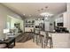 Modern kitchen with bar seating, stainless steel appliances, and open-concept design at 4018 Harmattan Dr, Denver, NC 28037