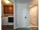 Convenient laundry room with side-by-side washer and dryer and ample cabinet space for storage at 4018 Harmattan Dr, Denver, NC 28037