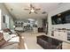 Comfortable living room with a large TV, open to the kitchen area with breakfast bar seating at 4018 Harmattan Dr, Denver, NC 28037