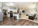 Open floor plan featuring a kitchen with a breakfast bar connected to the living room at 4018 Harmattan Dr, Denver, NC 28037