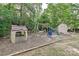 A charming playground with a swing set, playhouse, and slide provides a delightful space for to play and explore at 4018 Harmattan Dr, Denver, NC 28037