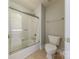 Bathroom featuring a glass shower door, white tile, and a matching toilet at 4113 Hoffmeister Dr, Waxhaw, NC 28173