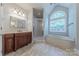 Elegant bathroom with soaking tub, stand up shower, and vanity at 4113 Hoffmeister Dr, Waxhaw, NC 28173