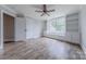 Bedroom has a big window, built in shelves, a window seat, ceiling fan, hard floors, and neutral paint at 4113 Hoffmeister Dr, Waxhaw, NC 28173
