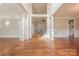 Spacious foyer features pristine hardwood floors and elegant white columns with views of the second story at 4113 Hoffmeister Dr, Waxhaw, NC 28173
